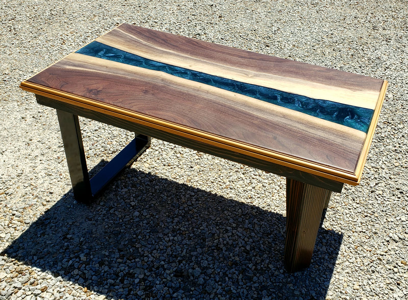 WALNUT AND EPOXY RIVER TABLE.